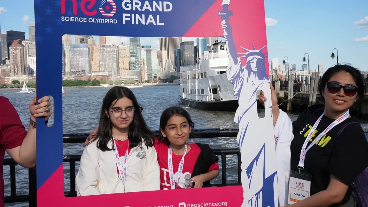 Finalists in front of the Grand Final backdrop showing the Manhattan skyline