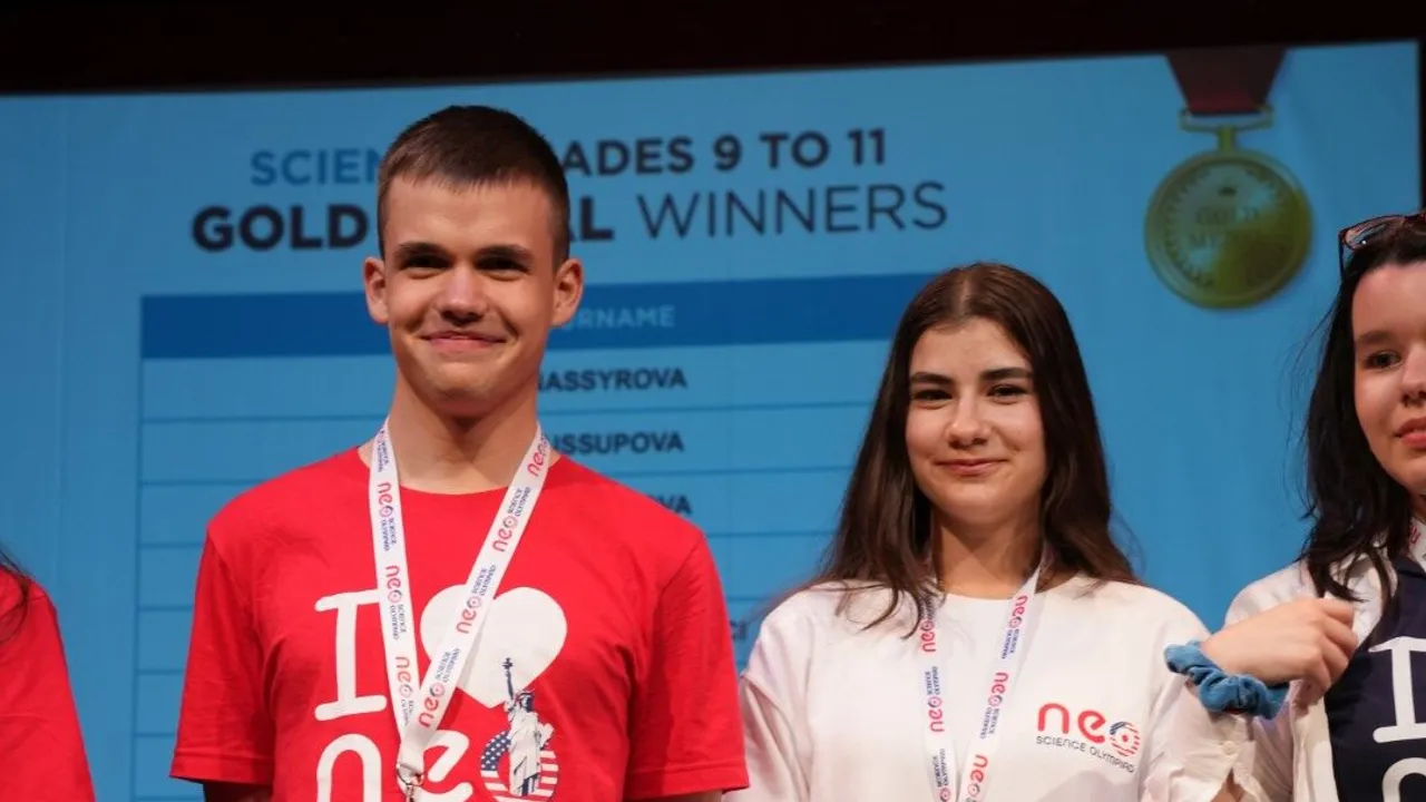 Two gold medallists on stage after their category was announced