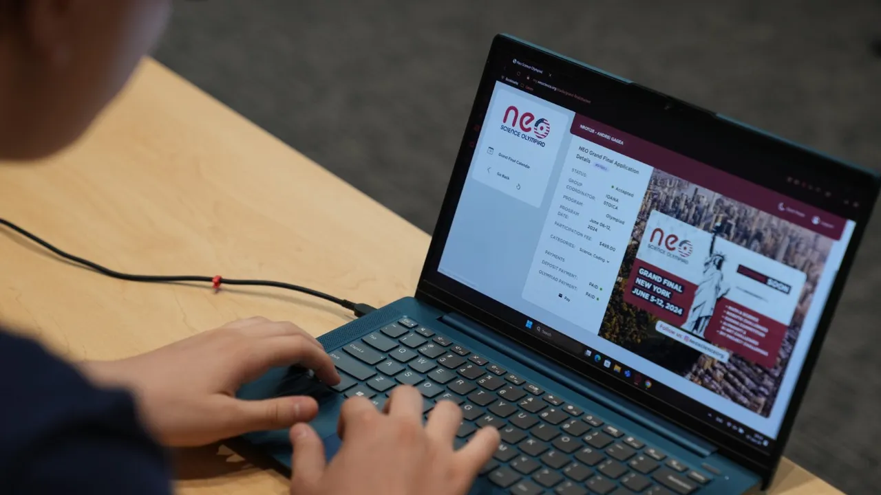 The olympiad's own panel open on a laptop